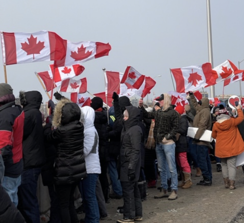 People, many waving Canadian flags, came out in numbers to support the truck convoy | Geoff Godard